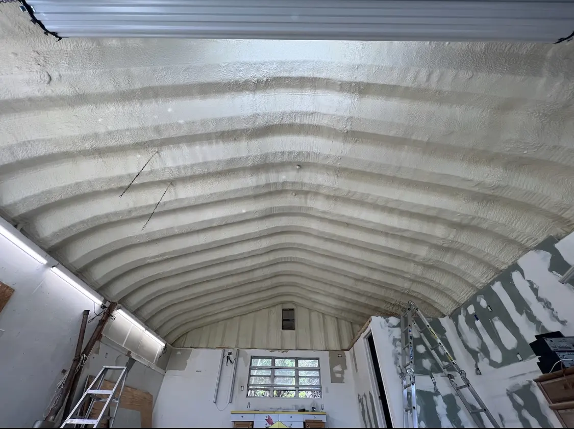 Spray polyurethane foam applied to the underside of a metal roof deck in Old Bridge